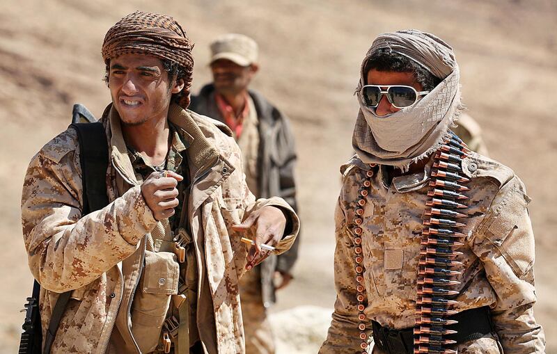 Yemeni tribesmen from the Popular Resistance Committees, who support forces loyal to the Saudi-backed Yemen president, rest as they guard a post in the Nihm district, on the eastern edges of the capital Sanaa, on February 2, 2018.
Backed by air support from the Saudi-led coalition, the Yemeni army in recent months has toppled multiple Huthi rebel bases on Nihm, a rugged chain of cloud-cutting mountains on the eastern edge of Sanaa, which has been held by the insurgents since September 2014. / AFP PHOTO / ABDULLAH AL-QADRY