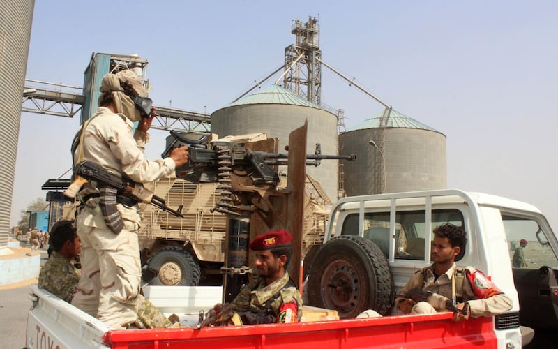 Soldiers with a military coalition in Yemen backed by Saudi Arabia and the United Arab Emirates stand guard at a facility of Yemen's Red sea mills company in the port city of Hodeida on January 22, 2019. Gunshots reverberate through a battle-scarred granary in the lifeline port city of Hodeida, where a mountain of grain meant for starving Yemenis remains inaccessible as a hard-won ceasefire comes under intense strain. The Red Sea mills, one of the last positions in Hodeida seized by Saudi and Emirati-backed Yemeni forces before last month's UN-brokered truce, holds enough wheat to feed nearly four million people for a month in a country on the brink of famine.
 / AFP / Saleh Al-OBEIDI
