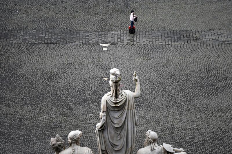 A girl drives a Segway across Piazza del Popolo in Rome, Italy.  Reuters