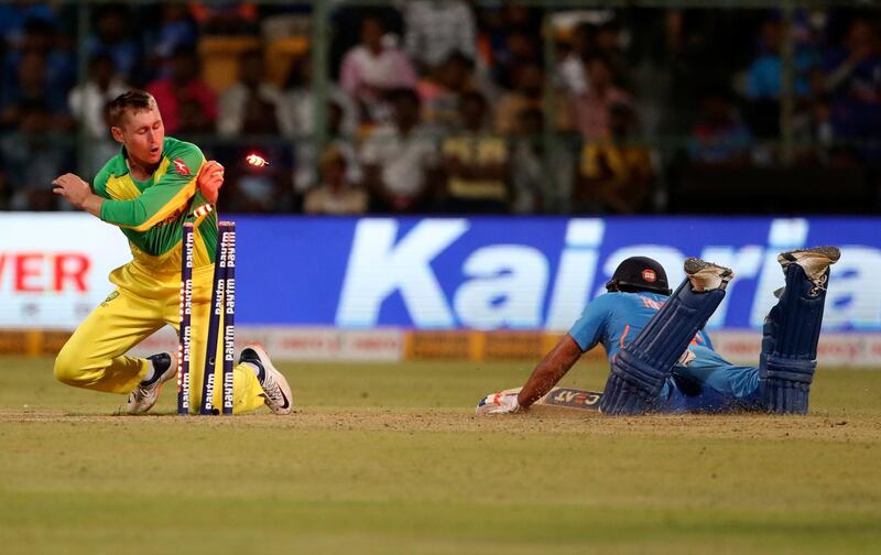 Australia's Marnus Labuschagne makes an unsuccessful attempt to run-out India batsman Rohit Sharma. AP