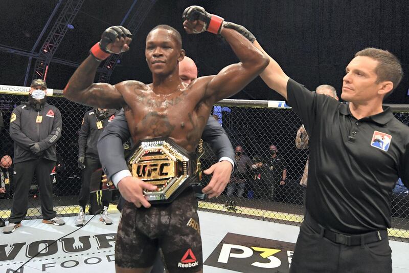 ABU DHABI, UNITED ARAB EMIRATES - SEPTEMBER 27:  UFC President Dana White places the championship belt on Israel Adesanya of Nigeria after defeating Paulo Costa of Brazil in their middleweight championship bout during UFC 253 inside Flash Forum on UFC Fight Island on September 27, 2020 in Abu Dhabi, United Arab Emirates. (Photo by Josh Hedges/Zuffa LLC)