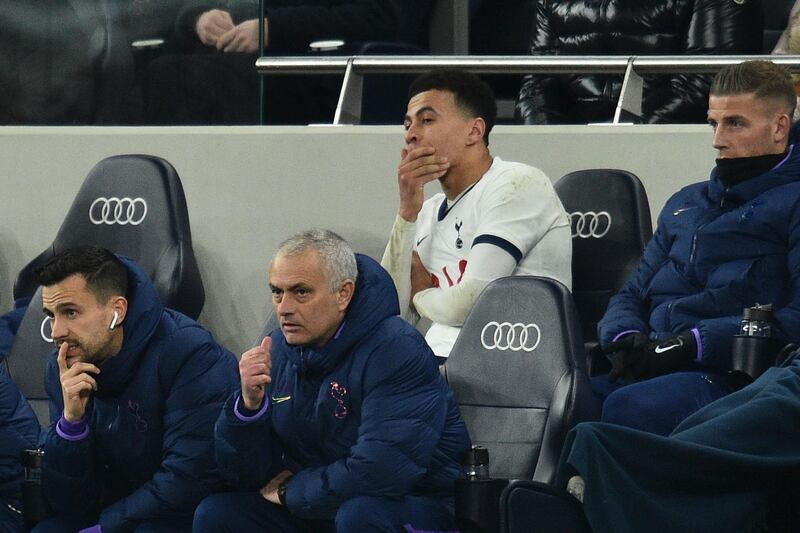 Tottenham midfielder Dele Alli and coach Jose Mourinho watch the match. AFP
