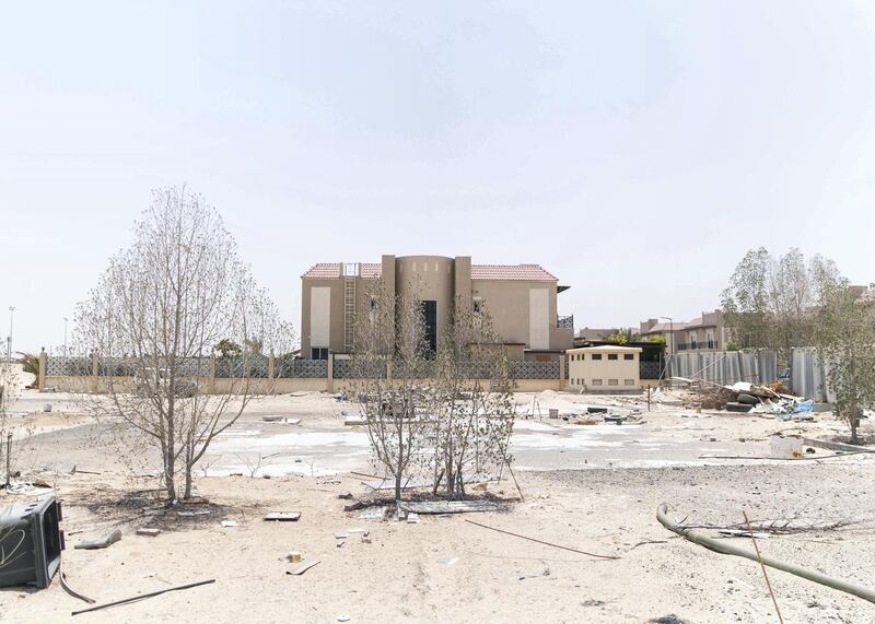 DUBAI, UNITED ARAB EMIRATES - JULY 15 2019.

Some residents and investors of Living Legends have paid Dh6m for villas, and pay Dh25,000 a year in service charges but the development still looks like a construction site, with an unfinished golf course, roads, open sewer works near the school, poor lighting and no desert boundary meaning dangerous snakes and animals are regularly getting into the gardens and villas. 

(Photo by Reem Mohammed/The National)

Reporter: NICK WEBSTER
Section: NA