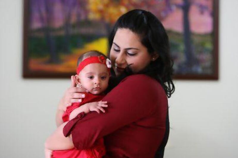 Samaiya Sakrani with her daughter, 6-month-old Rania, at her villa in Mirdif in Dubai. Pawan Singh/The National
