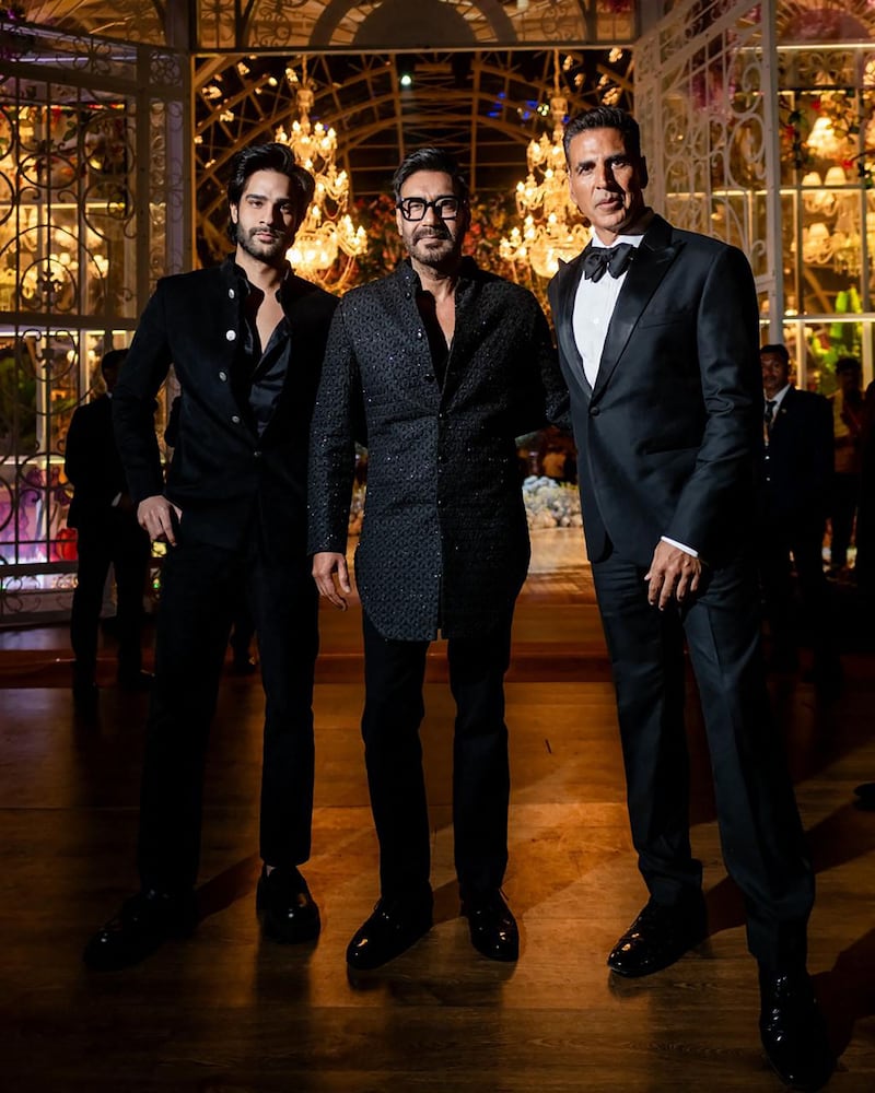 Bollywood actors Ajay Devgn, centre, and Akshay Kumar, right