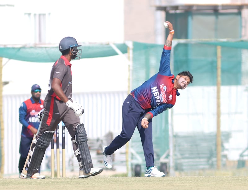 Nepal's Sandeep Namichhane bowls against UAE.