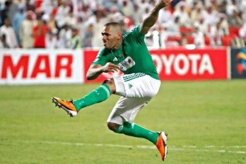 Al Ahli’s Victor Simoes scores the winning penalty against Al Jazira.