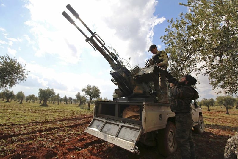 Rebel fighters man an anti-aircraft weapon at the front line against forces loyal to Syria's President Bashar Al Assad near Aleppo on February 17. Ammar Abdullah / Reuters   