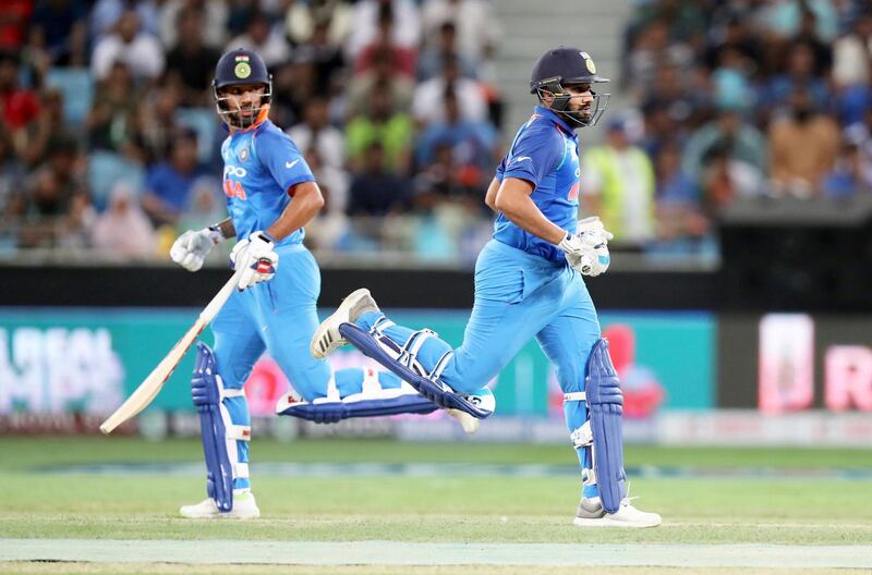 DUBAI , UNITED ARAB EMIRATES, September 19 , 2018 :- Left to Right - Shikhar Dhawan and Rohit Sharma running between the wickets during the Asia Cup UAE 2018 cricket match between Pakistan vs India held at Dubai International Cricket Stadium in Dubai. ( Pawan Singh / The National )  For Sports. Story by Paul