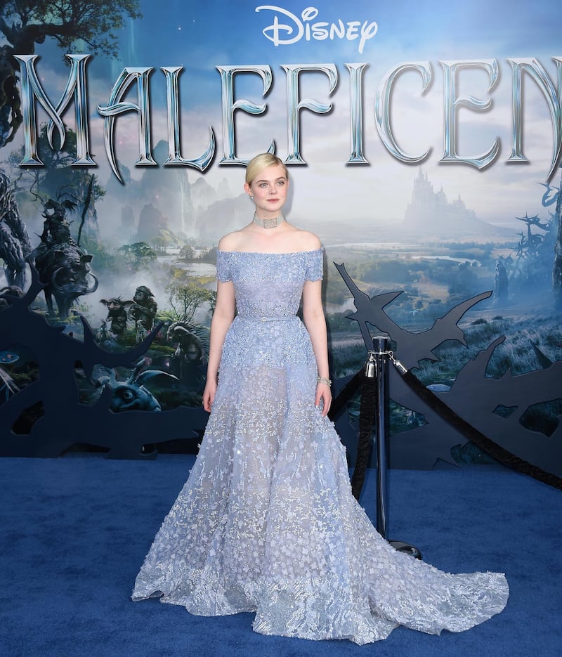 Actress Elle Fanning arrives for the world premiere of Disney's "Maleficent," May 28, 2014, at El Capitan Theatre in Hollywood, California. AFP PHOTO / ROBYN BECK (Photo by ROBYN BECK / AFP)