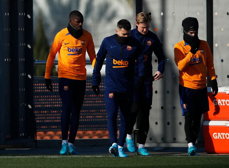 Ousmane Dembele and Frenkie de Jong with teammates during training. Reuters