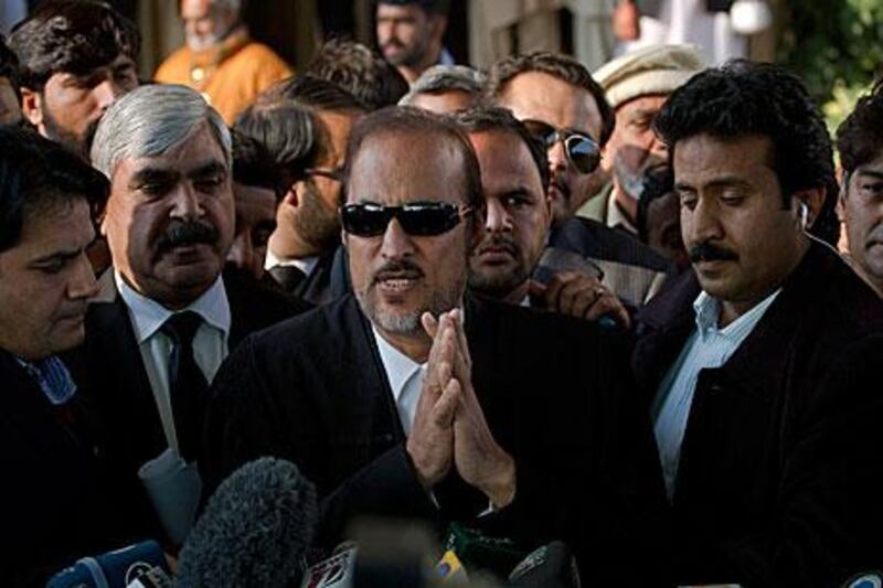 Baber Awan, a senator for the ruling party and lawyer, defends Asif Ali Zardari outside the Supreme Court in Islamabad yesterday.