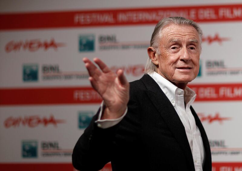 FILE PHOTO: Director Joel Schumacher waves as he poses during a photo call at the International Rome Film Festival November 3, 2011. REUTERS/Alessandro Bianchi/File Photo