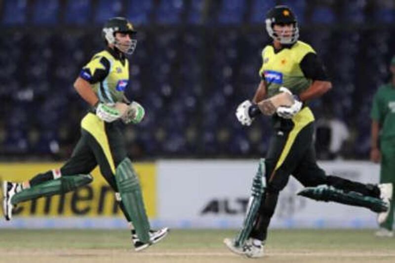 Pakistani cricketer Salman Butt (L) and teammate Nasir Jamshed run between the wickets during the Super League Asia Cup match between Pakistan and Bangladesh.