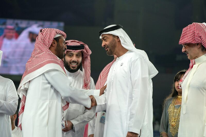 AL AIN, UNITED ARAB EMIRATES - April 18, 2019: HH Sheikh Mohamed bin Zayed Al Nahyan Crown Prince of Abu Dhabi Deputy Supreme Commander of the UAE Armed Forces (2nd R) greets a guest during the 2018–19 Zayed Champions Cup final football match between Al Hilal and Etoile du Sahel, at Hazza bin Zayed Stadium.

( Mohamed Al Hammadi / Ministry of Presidential Affairs )
---
