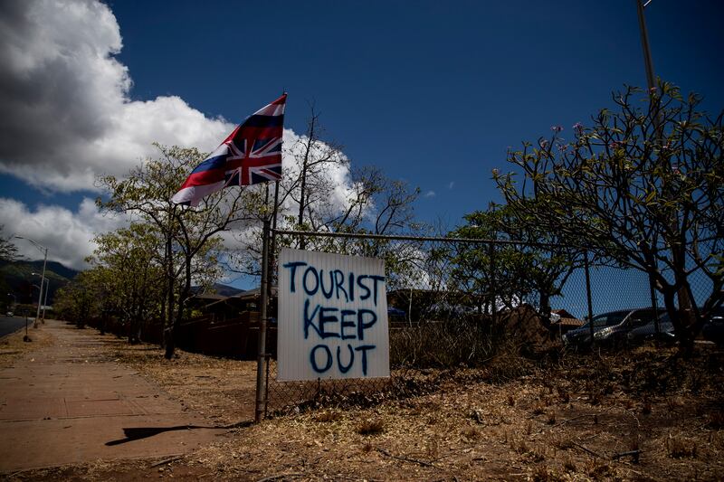 A sign reads 'Tourist Keep Out' at the entrance to a neighbourhood after the wildfire swept through the city of Lahaina. EPA