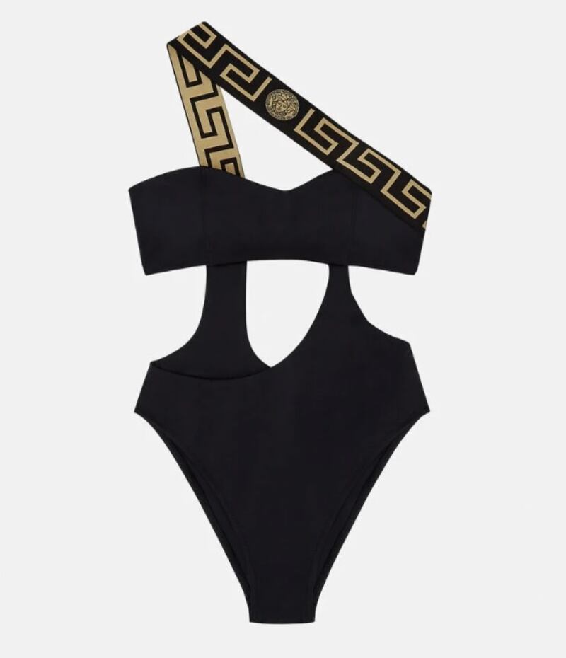 One-shoulder swimsuits: the Versace Greca Border one-piece swimsuit is a high leg, asymmetric option. The Versace logo adorns the straps to combine two trends: cut-out and one-shoulder; Dh1,350, versace.com. Photo: Versace