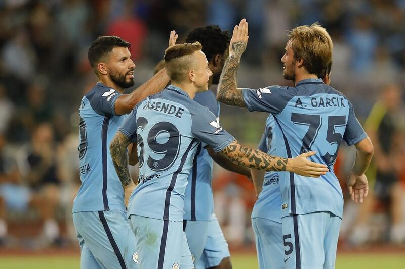 Sergio Aguero (L) of Manchester City celebrates with team mates after he scores the first goal during the 2016 International Champions Cup match between Manchester City and Borussia Dortmund at Shenzhen Universiade Stadium on July 28, 2016 in Shenzhen, China.  (Photo by Lintao Zhang/Getty Images)