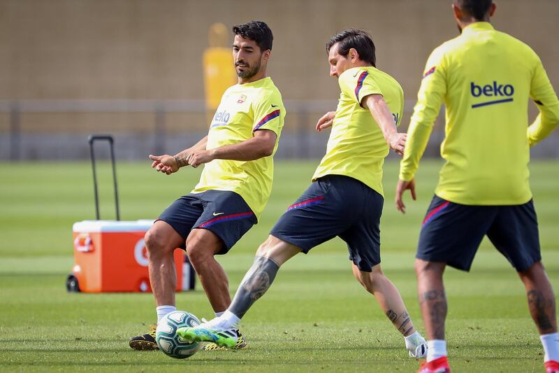 Luis Suarez and Lionel Messi take part in a training session. Getty Images