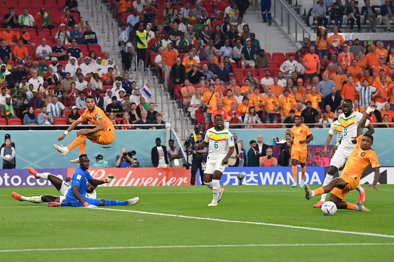 Netherlands' forward Cody Gakpo, right, misses a chance. AFP