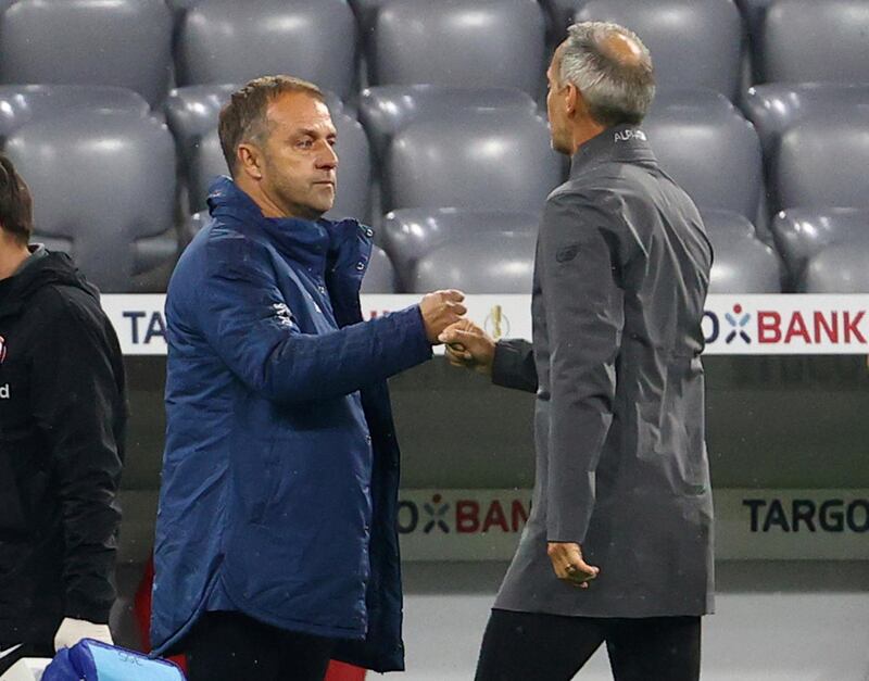 Eintracht Frankfurt coach Adi Hutter, and Bayern's, Hansi Flick (l) at the end of the game. AP