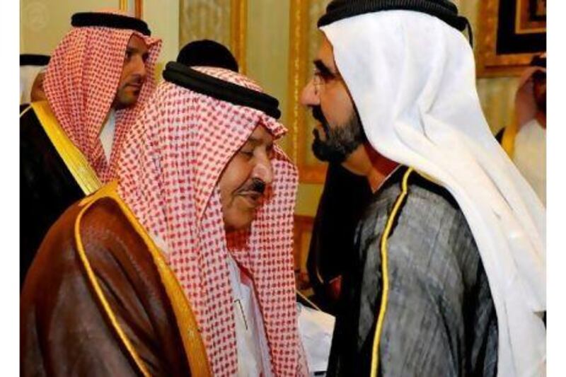 Prince Nayef bin Abdulaziz Al Saud, left, receives condolences from Sheikh Mohammed bin Rashid, Vice President of the UAE and Ruler of Dubai, during the funeral for Prince Sultan bin Abdulaziz Al Saud.