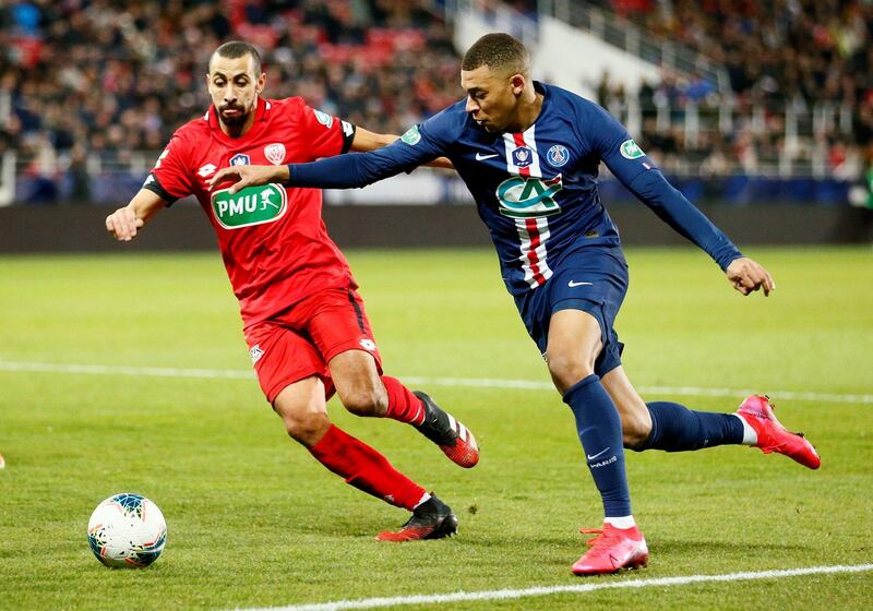 Kylian Mbappe, right, with Dijon's Fouad Chafik. Reuters