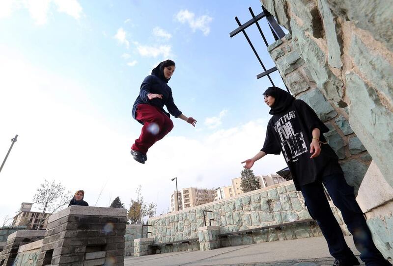 Iranian women practice parkour in Tehran’s Tavalod Park. Atta Kenare / AFP / March 13, 2014