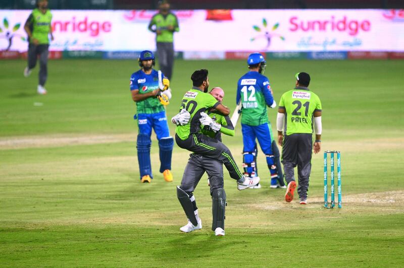 Lahore Qalandars' cricketers celebrate after winning the PSL qualifier against Multan Sultans at the National Stadium in Karachi on Sunday. AFP