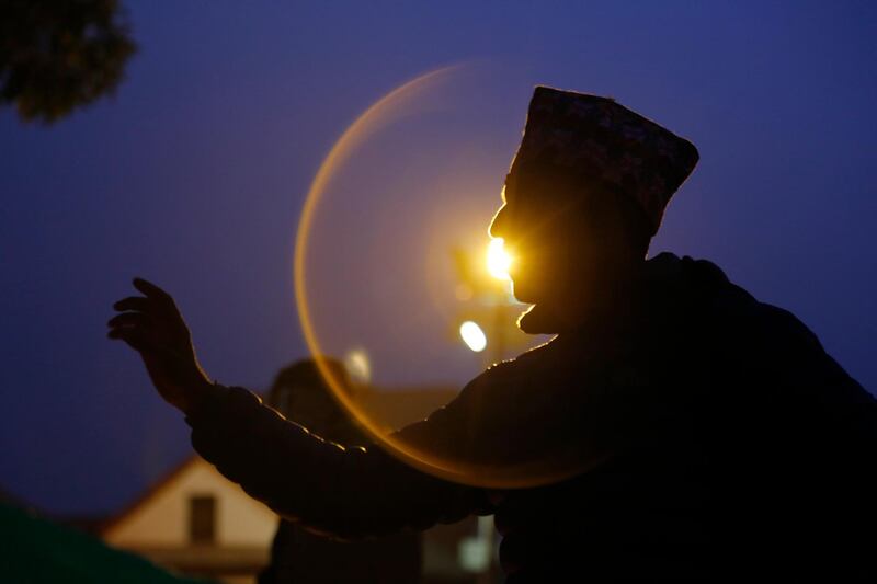 A Nepalese priest performs rituals. AP Photo