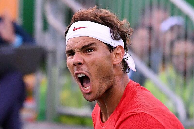 Spain’s Rafael Nadal celebrates after he and Spain’s Marc Lopez beat Canada’s Vasek Pospisil and Canada’s Daniel Nestor during their men’s doubles semi-final tennis match at the Olympic Tennis Centre of the Rio 2016 Olympic Games in Rio de Janeiro on August 11, 2016. Luis Acosta / AFP