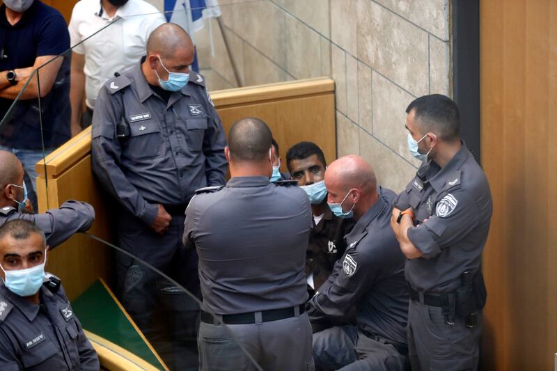 Zakaria Zubeidi, centre, one of the six who escaped from a high-security prison, at a court in Nazareth. EPA