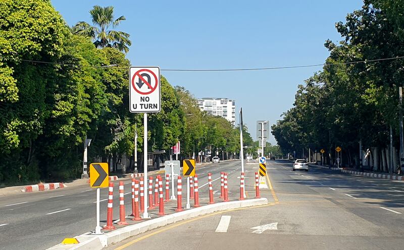 A car drives along an empty road in Yangon. On Sunday, five people were killed when security forces drove a car into an anti-coup protest in the city. EPA