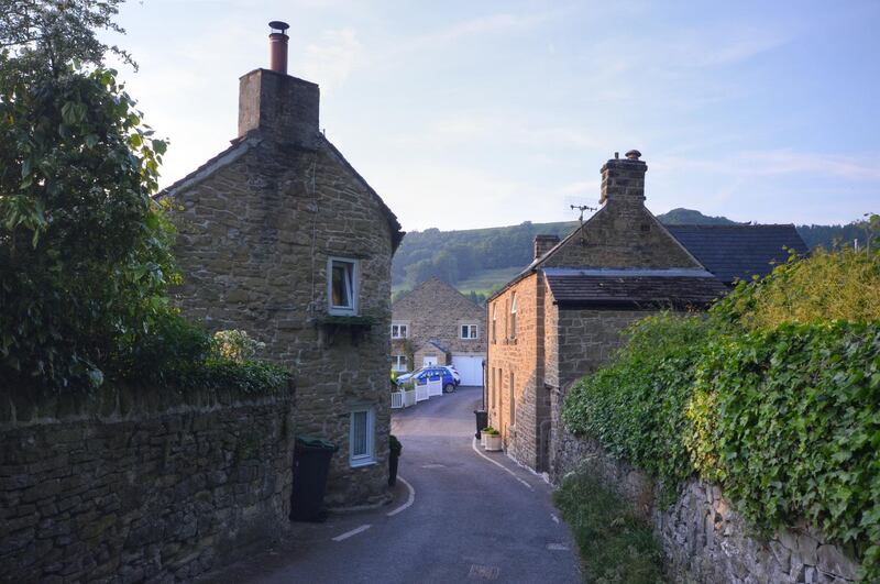 A street through a traditional Peak District village, famous for an outbreak of bubonic plague in 1665 where the villagers self-imposed quarantine.