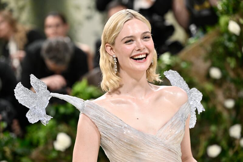 Elle Fanning in Cartier jewellery and  a resin dress by Balmain. AP