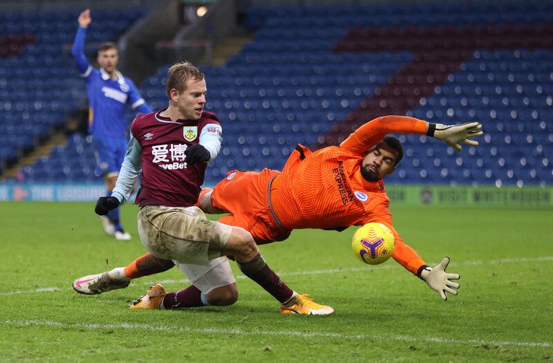 BURNLEY, ENGLAND - FEBRUARY 06: Matej Vydra of Burnley has a shot saved by Robert Sanchez of Brighton & Hove Albion during the Premier League match between Burnley and Brighton & Hove Albion at Turf Moor on February 06, 2021 in Burnley, England. Sporting stadiums around the UK remain under strict restrictions due to the Coronavirus Pandemic as Government social distancing laws prohibit fans inside venues resulting in games being played behind closed doors.  (Photo by Clive Brunskill/Getty Images)
