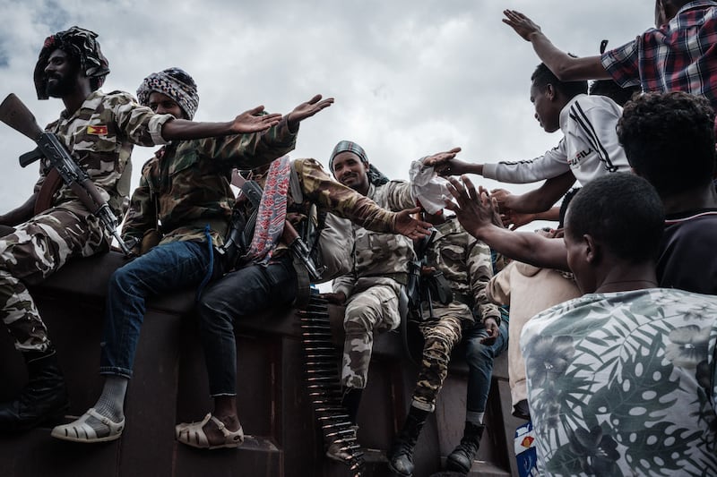 Soldiers of Tigray Defence Force (TDF) touch to people on a truck as they arrive in Mekelle.