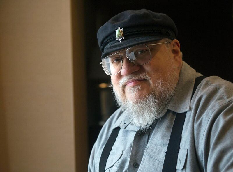 FILE - In this March 12, 2012 file photo, George R.R. Martin, author of the popular book series "A Song of Ice and Fire," which inspired the hit HBO series "Game of Thrones" poses in Toronto. Martin says the next â€œSong of Ice and Fireâ€ book has a real chance of coming out in 2018. In a weekend posting on his web site, Martin wrote that he is working hard on â€œThe Winds of Winter,â€ the long-awaited sixth volume in the series. He added that he has â€œgood days and bad daysâ€ and is still months away from finishing.    (AP Photo/The Canadian Press, Nathan Denette, File)