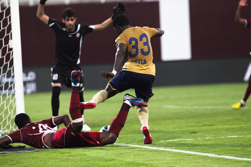 Abu Dhabi, UAE, November 12, 2012:

Al Wahda faced off agianst Dubai tonight and prevaled 2-1 to end the season on a positive note.

Dubai's Keita slips by Al Wahd'as defender but wa sunable to score.

Lee Hoagland/The National



