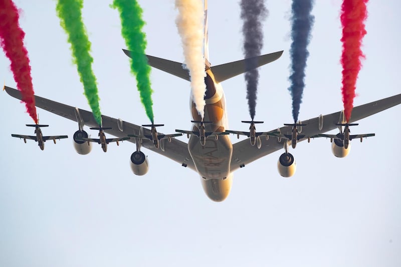 ABU DHABI, UNITED ARAB EMIRATES - March 14, 2019: Etihad Airways and the UAE Forsan Aerobatics team perform a flyby during the opening ceremony of the Special Olympics World Games Abu Dhabi 2019, at Zayed Sports City. 
( Ryan Carter for the Ministry of Presidential Affairs )
---