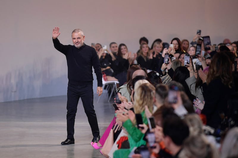 Lebanese fashion designer Elie Saab greets the audience at the end of his show at Paris Fashion Week. AFP