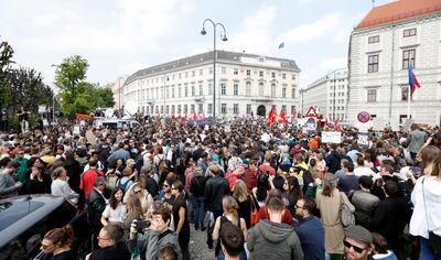 epa07580565 People gather outside the office of Austria's Vice Chancellor Strache in Vienna, Austria, 18 May 2019. Austrian Vice Chancellor Strache on 18 May 2019 said he will step down from his post as media caught the far-right FPOe's leader Strache in a corruption allegations scandal. German media have on 17 May 2019 published a secretly recorded video of Strache in Ibiza in July 2017, where Heinz-Christian Strache is claimed to meet an alleged niece of a unknown Russian oligarch who wanted to invest large sums of money in Austria.  EPA/FLORIAN WIESER