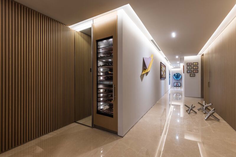 A built-in beverage cooler in the well-lit hallway.