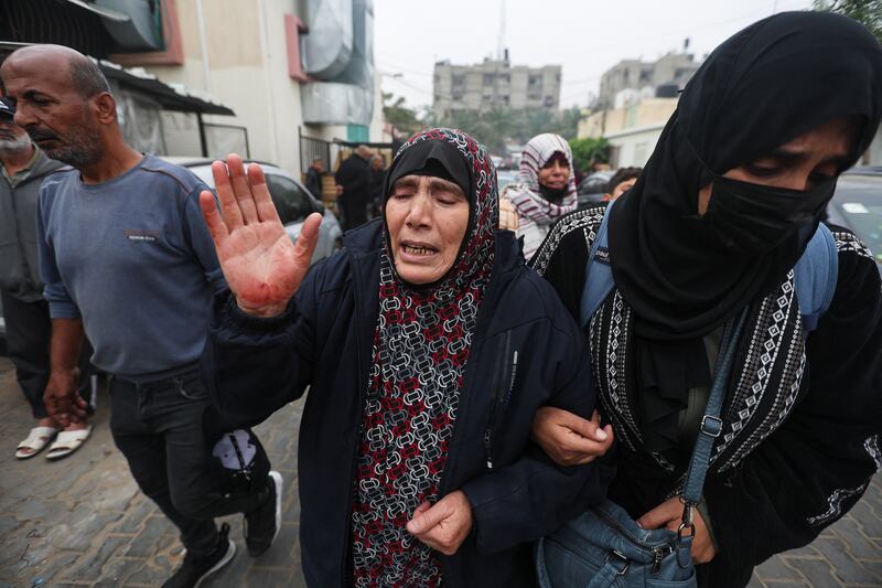 A woman reacts after the bodies of Palestinians killed during Israeli strikes on Ma'an school, east of Khan Younis, were laid out at Nasser Hospital. Reuters