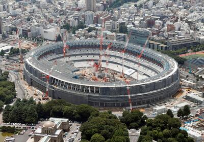 In this July 11, 2018, aerial photo shows New National Stadium for the Tokyo 2020 Olympics under construction, in Tokyo. The Japan Sports Council gave a progress report on the New National Stadium on Wednesday, July 18, 2018, saying the project is 40 percent complete with two years to go before the opening ceremony. (Kyodo News via AP)