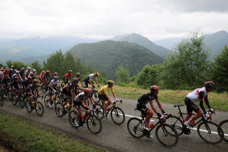 Race leader Tadej Pogacar in the peloton during Stage 16.