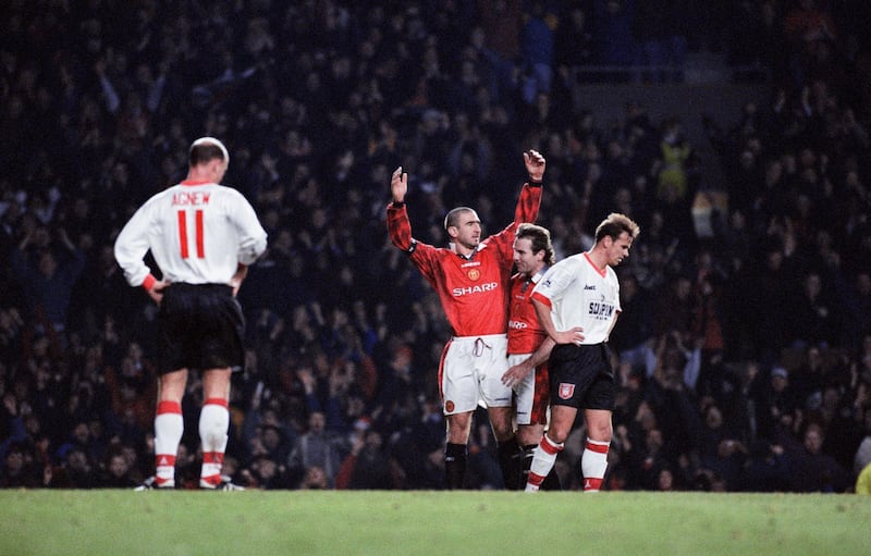 English Premier League match at Old Trafford. Manchester United 5 v Sunderland 0. United's Eric Cantona celebrates his goal, 21st December 1996. (Photo by Albert Cooper/Mirrorpix/Getty Images)