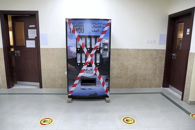 SHARJAH, UNITED ARAB EMIRATES , September 24 – 2020 :- Water dispenser machine closed for Covid 19 safety measure at the Victoria English School in Sharjah. New Covid safety setup in different areas of the school such as hand sanitizer, safety message, social distancing stickers pasted on the floor, disinfection tunnels installed at all the gates of the school. Schools in Sharjah are opening on 27th September.  (Pawan Singh / The National) For News. Story by Salam