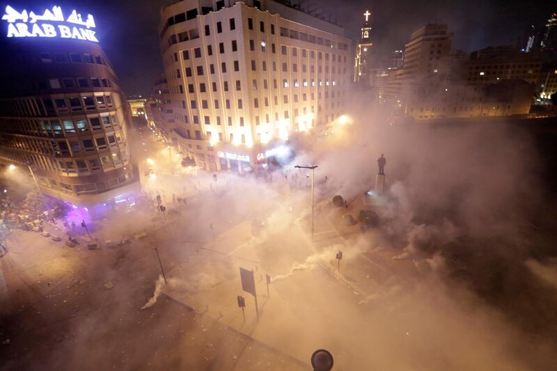 Lebanese riot police fire tear gas. AP Photo