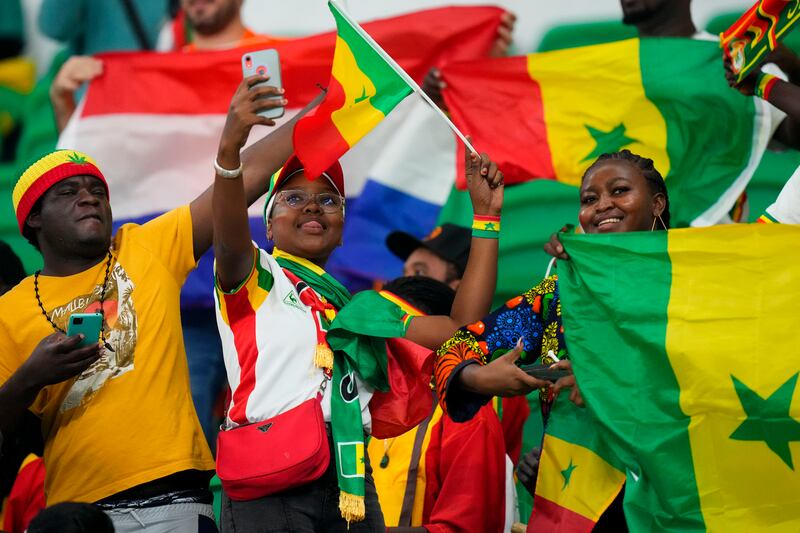 Others settled for flags, hats and selfies. AP Photo